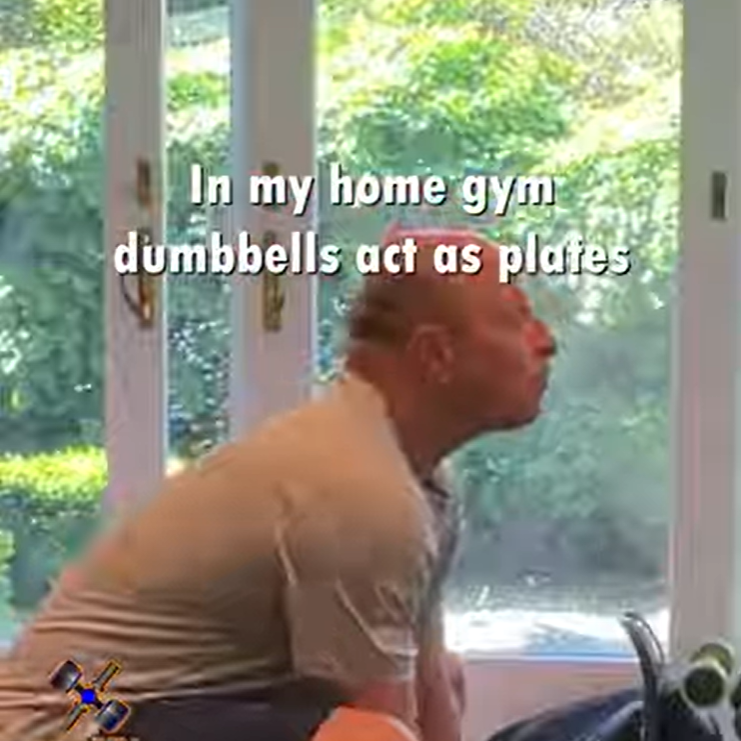 How to Do Barbell Shrugs With Dumbbells on the Bar