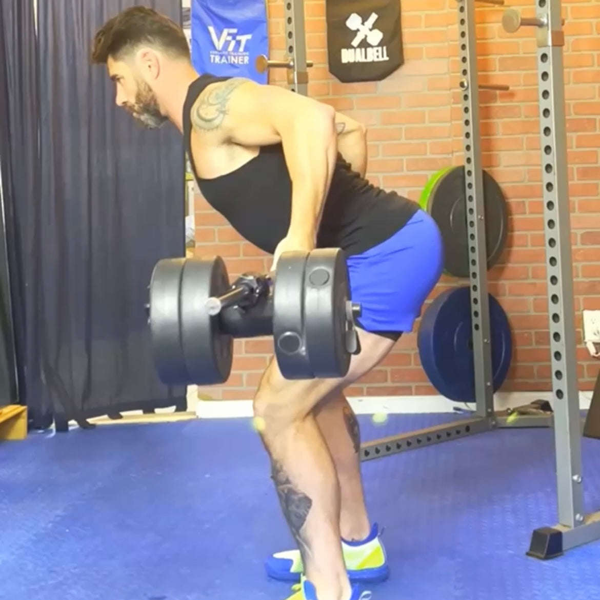 personal trainer performs a bent over row using dualbell dumbbell converters